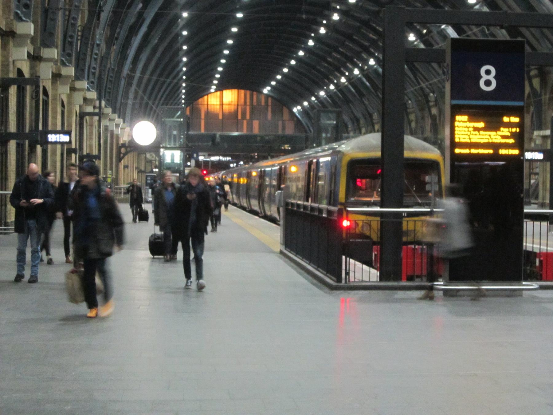 Passengers walking along the platforms at London King's Cross